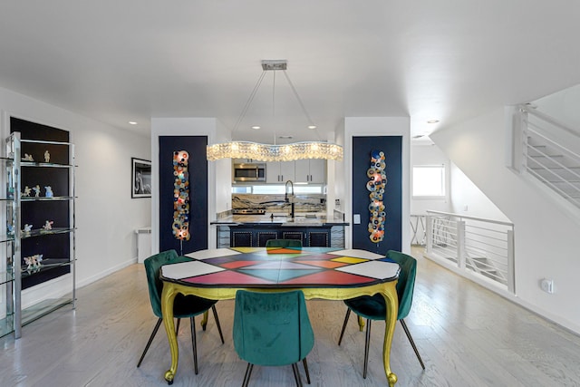 dining area with light hardwood / wood-style floors