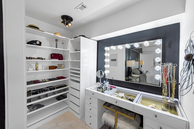 walk in closet featuring light hardwood / wood-style floors