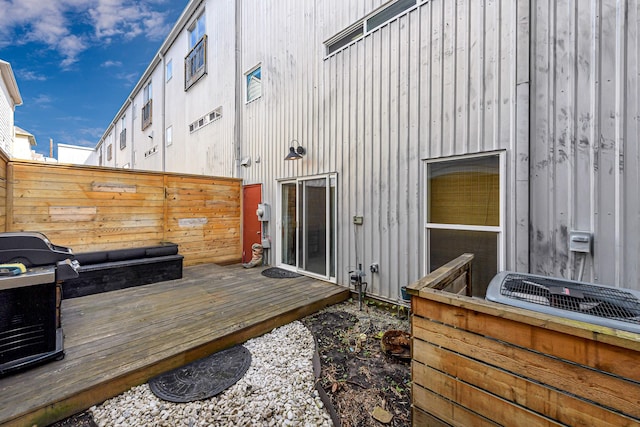 wooden terrace with area for grilling