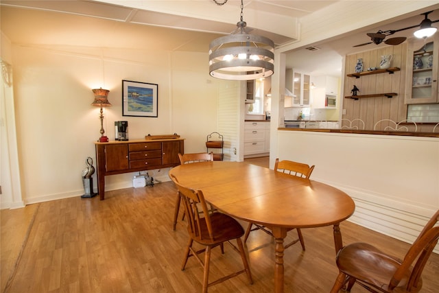 dining room featuring ceiling fan and light hardwood / wood-style flooring