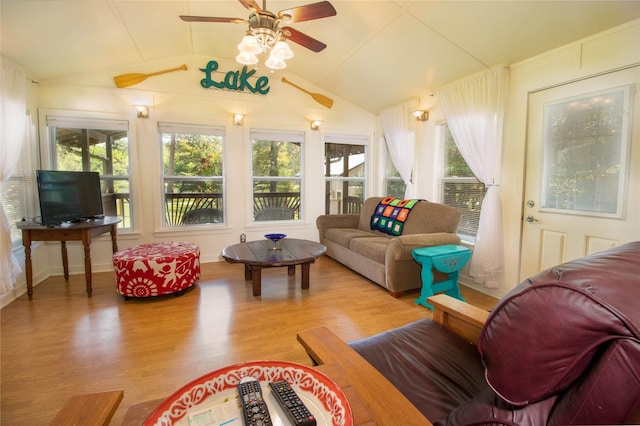 sunroom with lofted ceiling, a wealth of natural light, and ceiling fan