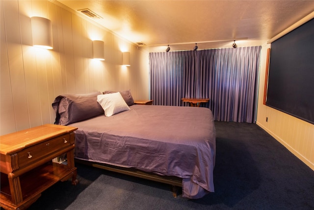 bedroom featuring ornamental molding and carpet