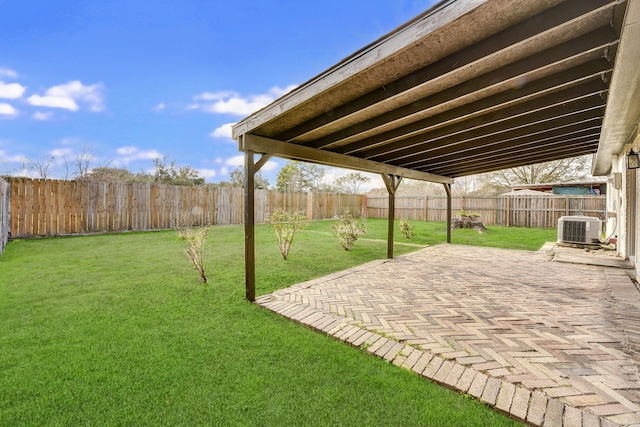 view of yard with central AC and a patio area