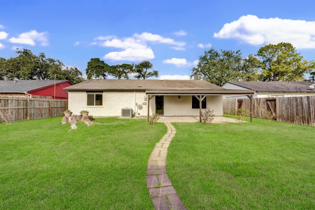 rear view of house featuring a patio, cooling unit, and a lawn