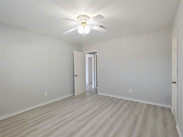 unfurnished room with ceiling fan and light hardwood / wood-style flooring