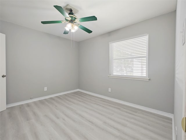 unfurnished room with ceiling fan and light wood-type flooring