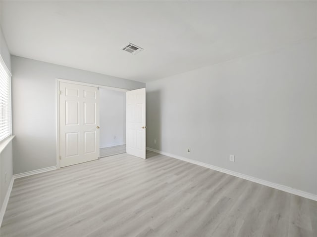 unfurnished bedroom featuring light wood-type flooring