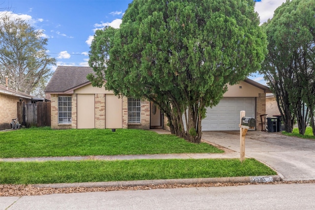 view of front facade featuring a garage and a front lawn