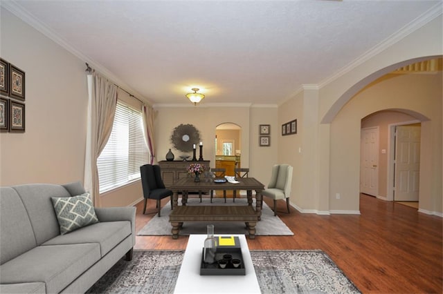 living area with crown molding and wood finished floors