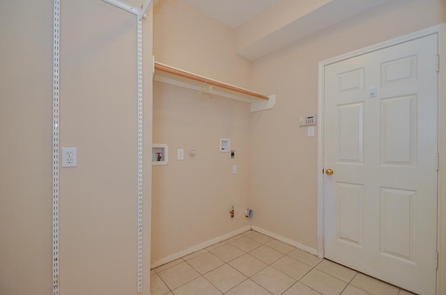 laundry room featuring washer hookup, hookup for an electric dryer, light tile patterned flooring, gas dryer hookup, and baseboards