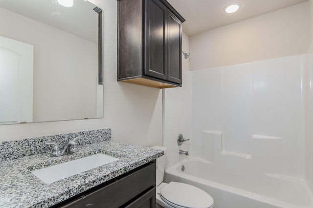 full bathroom with toilet, tub / shower combination, and vanity