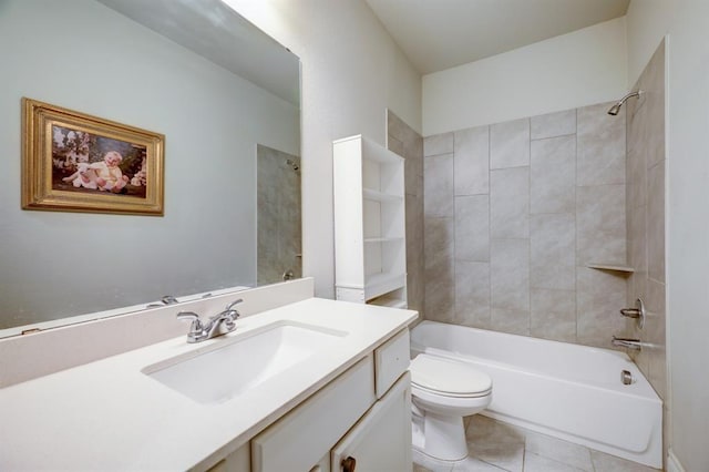 full bathroom featuring tile patterned flooring, vanity, tiled shower / bath combo, and toilet