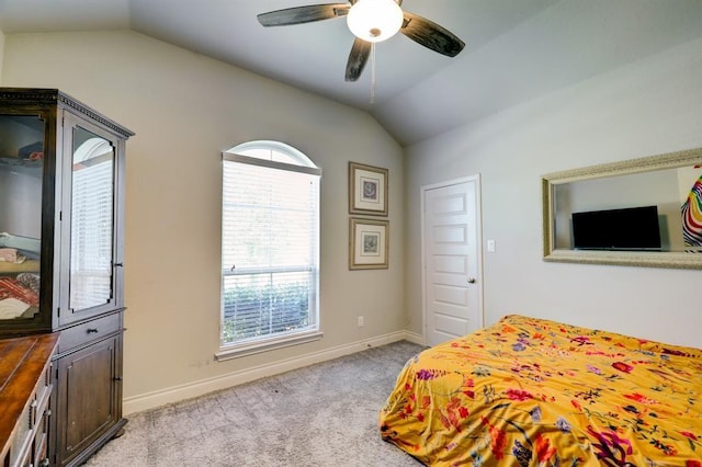 bedroom with lofted ceiling, light colored carpet, and ceiling fan