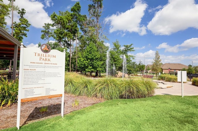 view of home's community with a yard