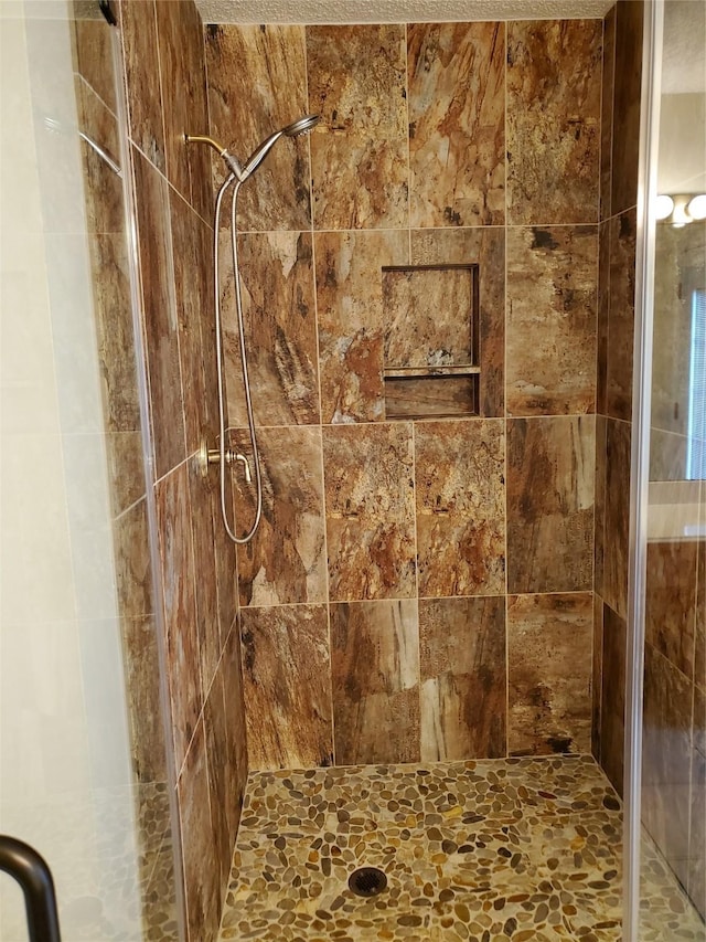 full bath featuring a shower stall