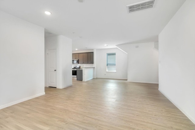 unfurnished living room with recessed lighting, baseboards, visible vents, and light wood finished floors