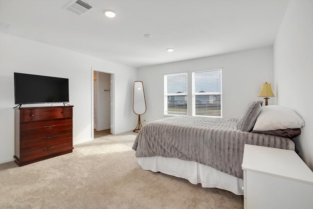 bedroom featuring light carpet, baseboards, visible vents, and recessed lighting