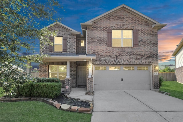 view of front facade with concrete driveway, a garage, fence, and brick siding