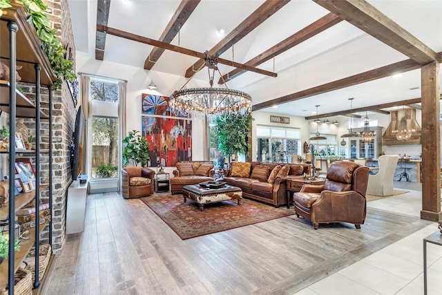 living room featuring beam ceiling, high vaulted ceiling, a chandelier, and light hardwood / wood-style floors