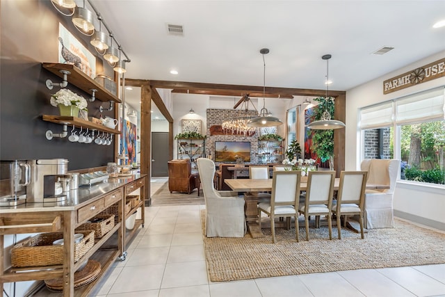 dining space featuring light tile patterned floors