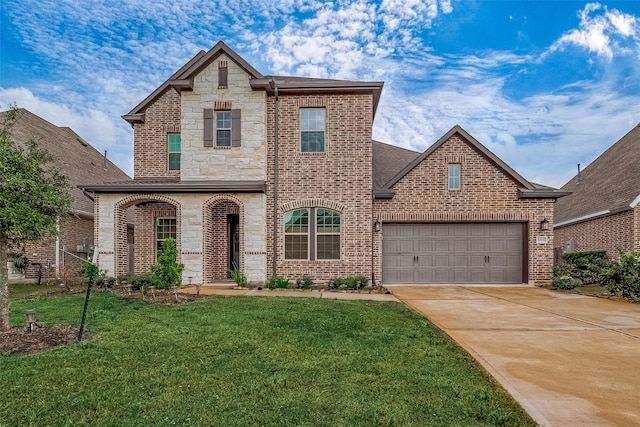 view of front of property featuring a garage and a front lawn