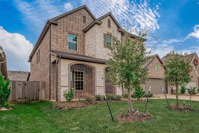 front facade featuring a garage and a front yard