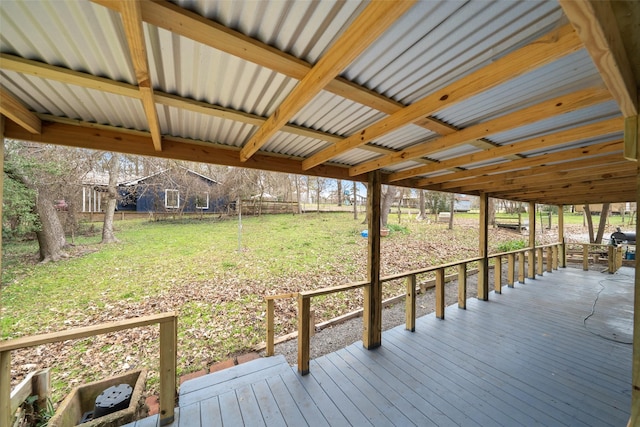 wooden deck with a lawn