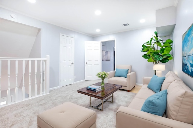 carpeted living room with recessed lighting, visible vents, and baseboards