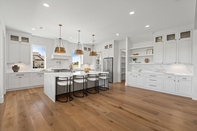 11585 Grandview Dr, Montgomery, TX 77356 - kitchen featuring high quality fridge, white cabinetry, a kitchen island with sink, open shelves, and recessed lighting