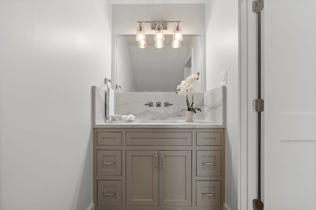 11585 Grandview Dr, Montgomery, TX 77356 - bathroom with vanity, a chandelier, and baseboards