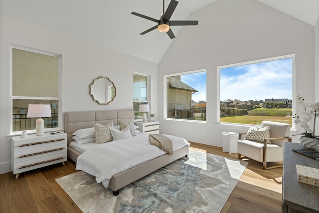 11585 Grandview Dr, Montgomery, TX 77356 - bedroom with high vaulted ceiling, wood finished floors, and ceiling fan