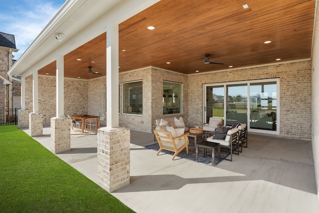 view of patio featuring a ceiling fan, outdoor lounge area, and fence