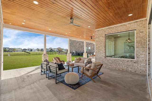 view of patio featuring an outdoor hangout area, ceiling fan, and fence