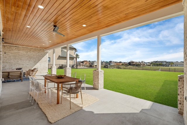 view of patio featuring fence and outdoor dining area