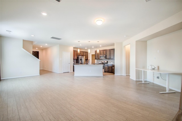 unfurnished living room featuring light hardwood / wood-style floors