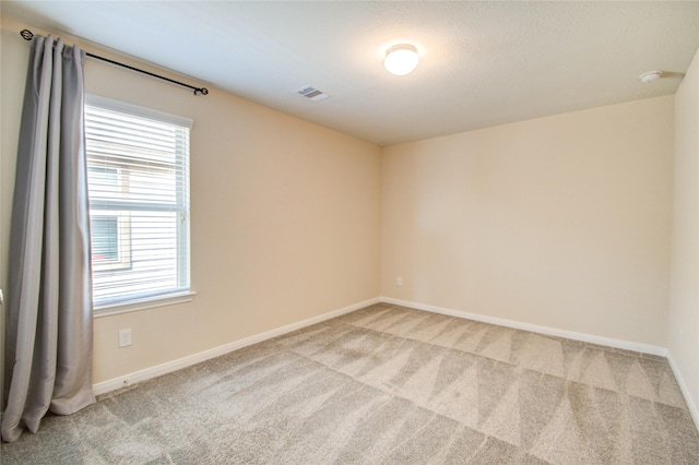 unfurnished room featuring carpet flooring