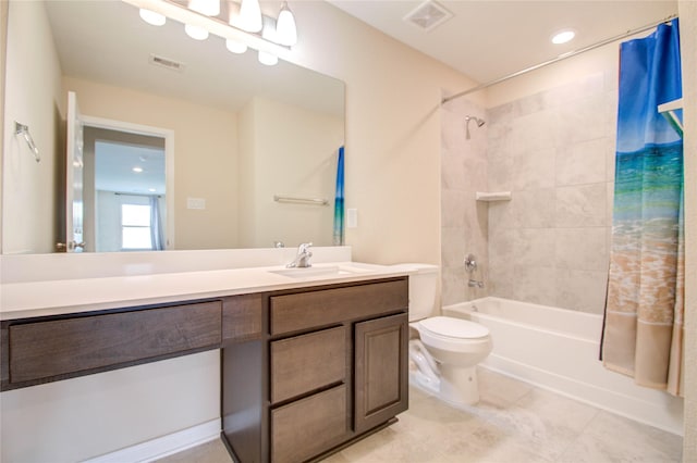 full bathroom with shower / tub combo with curtain, vanity, toilet, and tile patterned floors