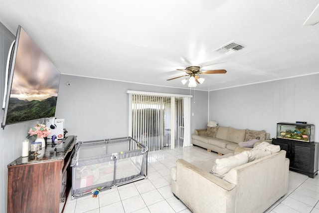 tiled living room with ceiling fan