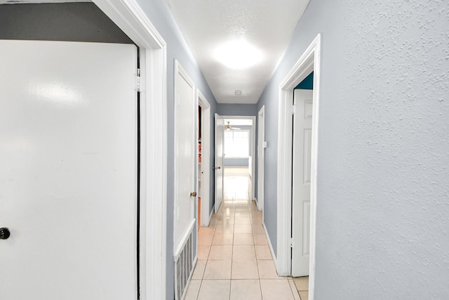 hallway with light tile patterned floors