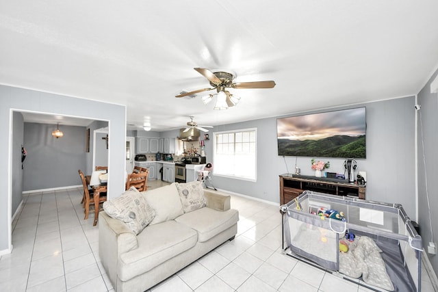 tiled living room with ceiling fan