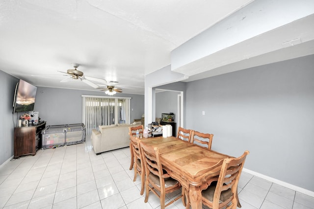 dining room featuring light tile patterned flooring and ceiling fan