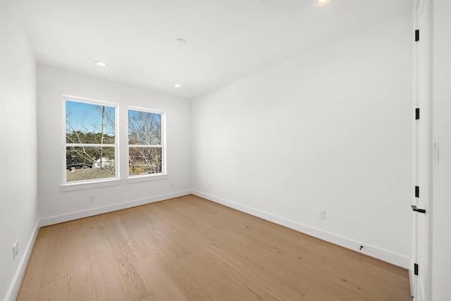 unfurnished room featuring light hardwood / wood-style floors