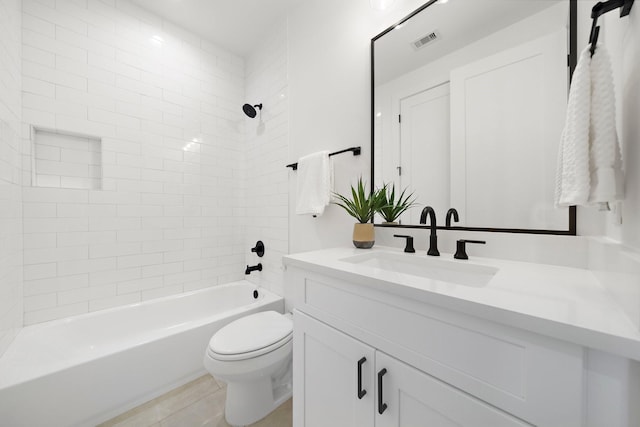 bathroom featuring toilet, visible vents, tub / shower combination, and vanity