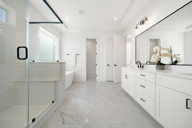 bathroom featuring vanity, plus walk in shower, and a raised ceiling