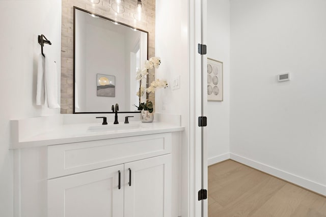 bathroom with vanity and hardwood / wood-style floors