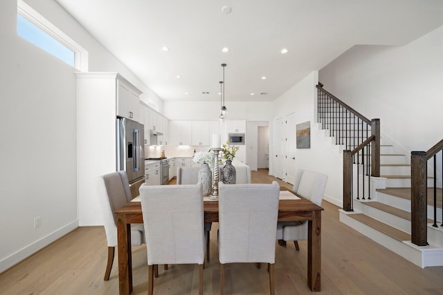 dining room with light hardwood / wood-style flooring