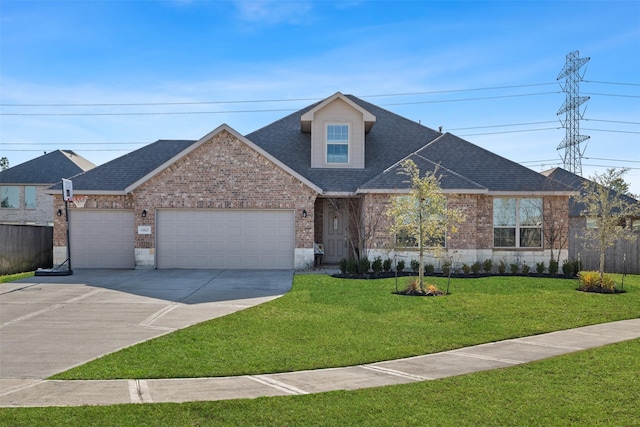 view of front of house featuring a front yard, brick siding, an attached garage, and a shingled roof