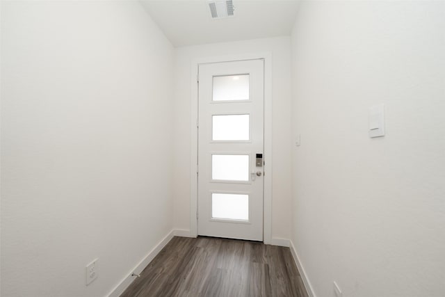 doorway to outside with dark hardwood / wood-style floors