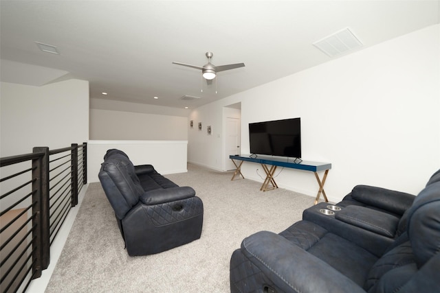 carpeted living room with ceiling fan