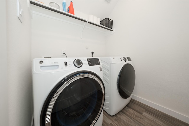 laundry room featuring independent washer and dryer and dark hardwood / wood-style flooring